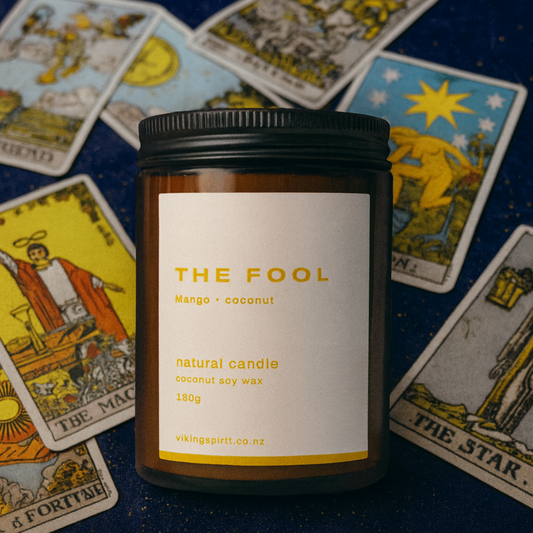 Candle labeled 'The Fool' on tarot cards
